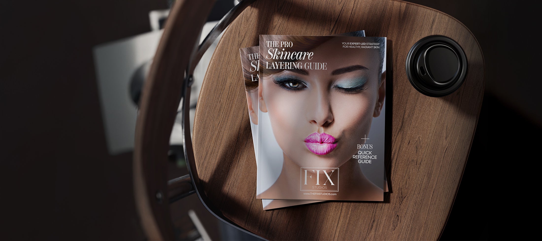 Fix Studios Pro Skincare Layering Guide displayed on a chair with a cup of coffee