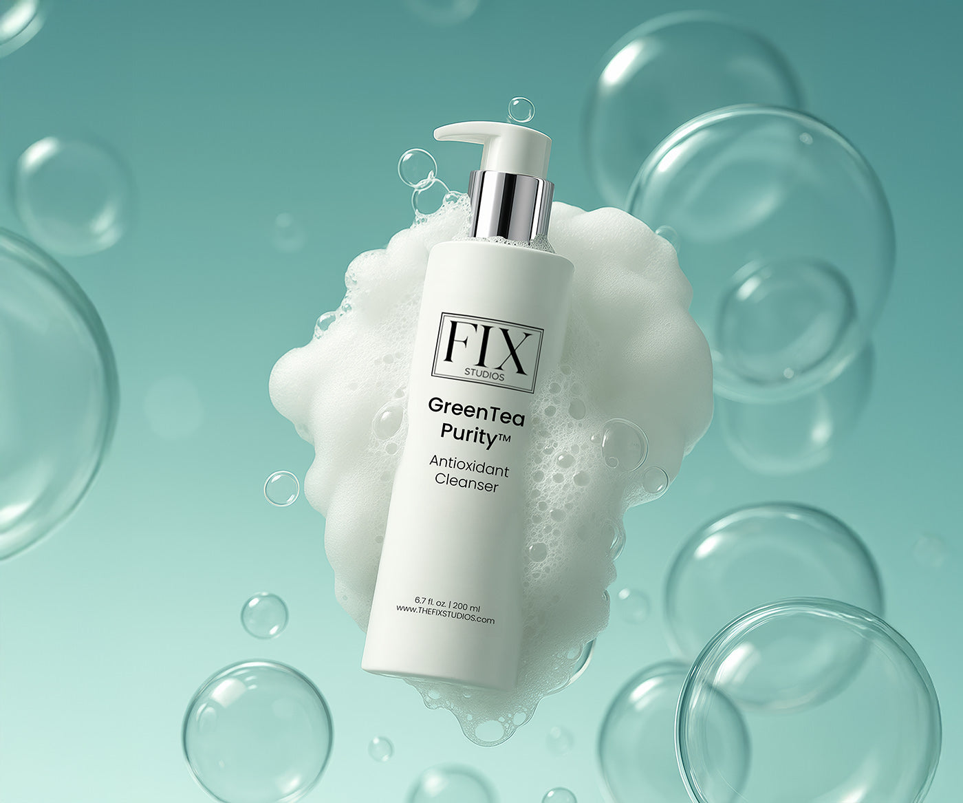 A bottle of medical-grade Fix Studios GreenTea Purity™ Antioxidant Cleanser floats with soap bubbles in the background