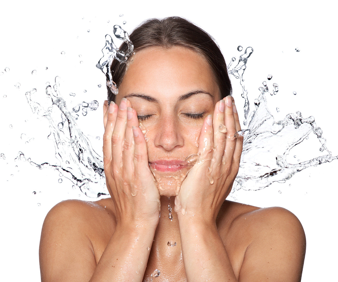 A woman rinses her face after washing it with medical-grade Fix Studios GreenTea Purity™ Antioxidant Cleanser