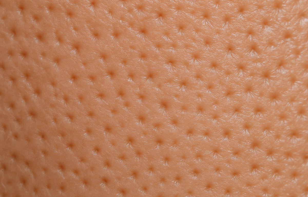 An ultra-closeup macro shot of clean pores on cheek using Fix Studios PorePerfect™ Refining Cleansing Pads Medical-Grade Acne Product