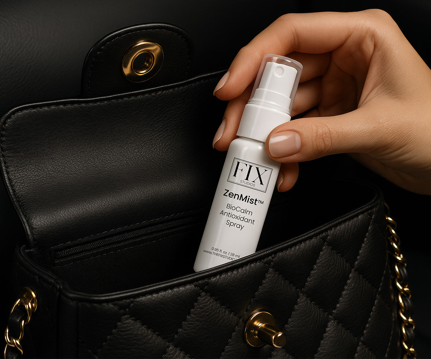 Fix Studios ZenMist™ BioCalm Antioxidant Spray pictured in travel-size being pulled from a woman's designer handbag