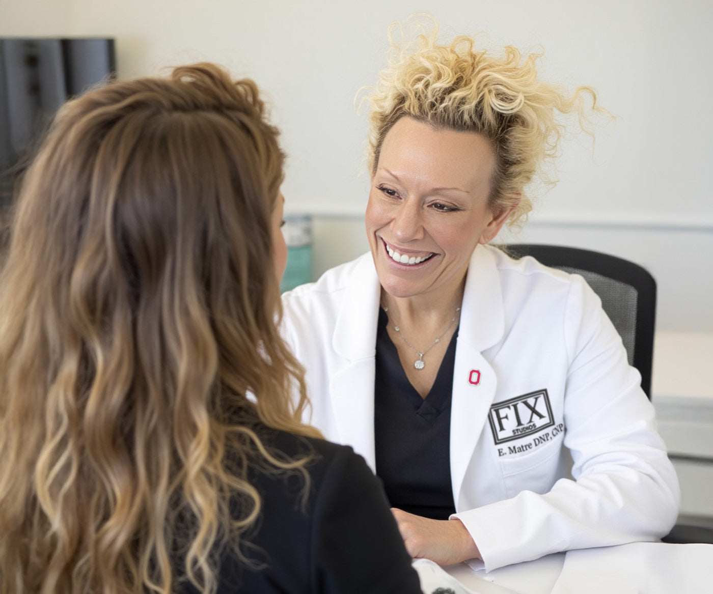 Elizabeth Matre DNP, CNP (aka Dr. Beth Matre) Greets a patient at fix studios medspa cincinnati mason OH