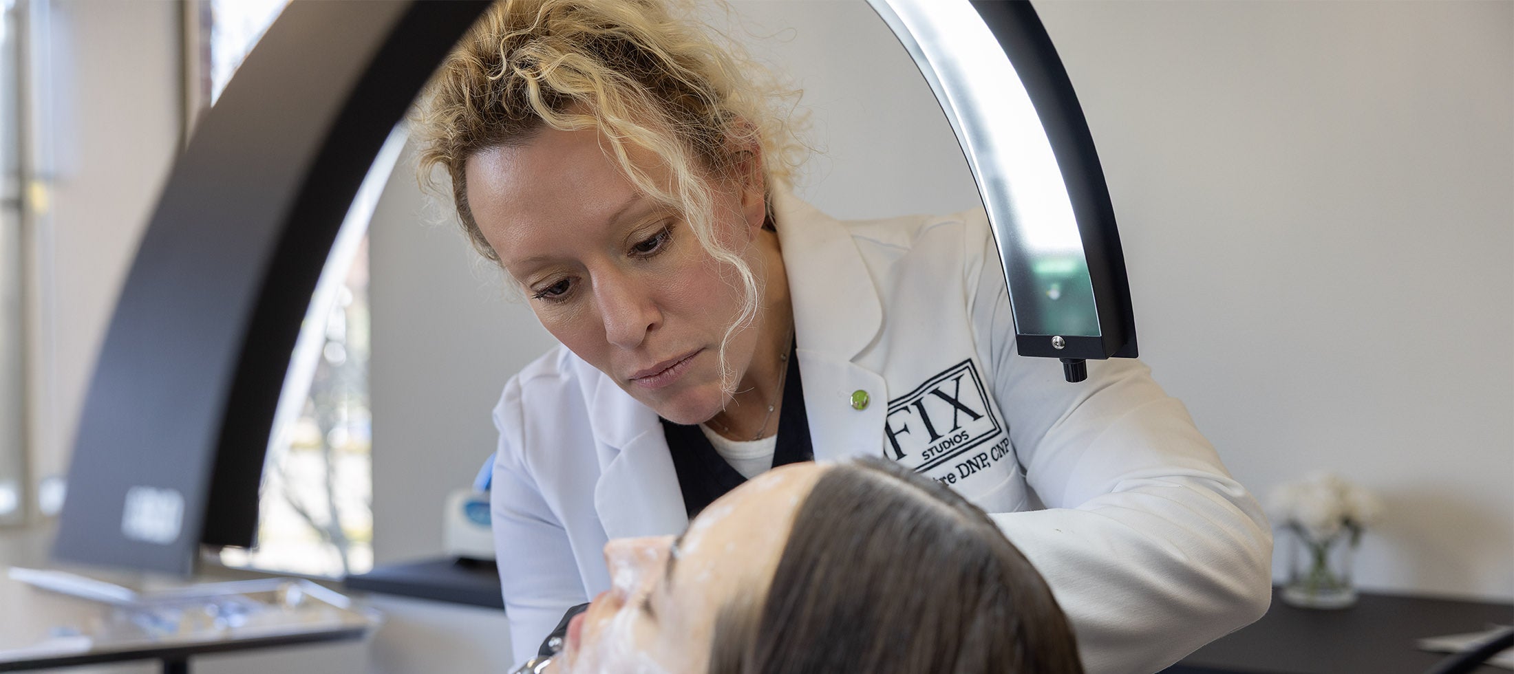 Dr Beth Matre DNP, CNP, performs facial treatments at Fix Studios Aesthetics & Skincare Medspa Cincinnati Mason OH