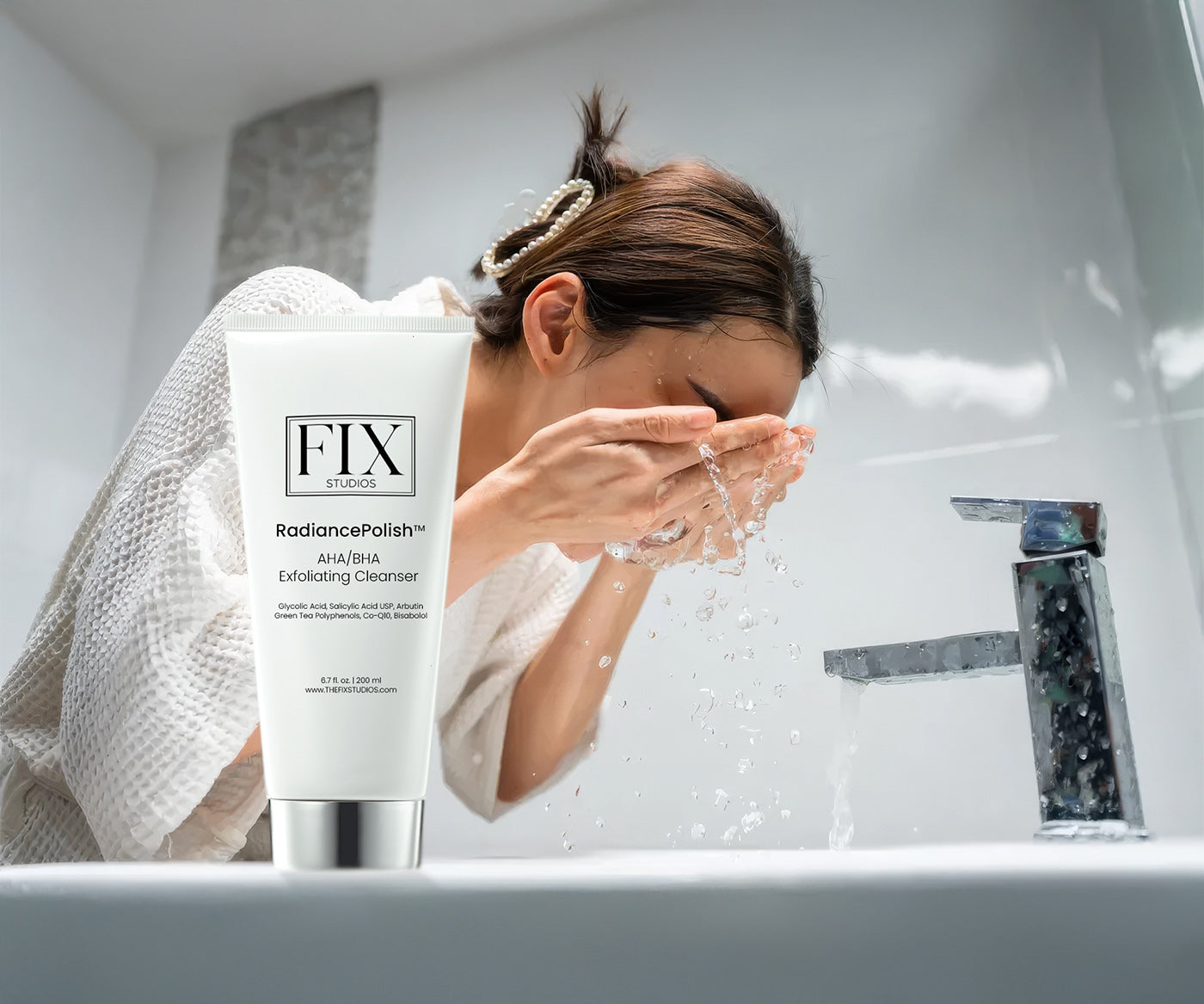 A beautiful woman exfoliates and washes her face with Fix Studios RadiancePolish Medical-Grade AHA/BHA Exfoliating Cleanser