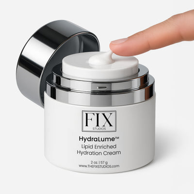 A finger uses the airless pump dispenser of Fix Studios medicalgrade HydraLume™ Lipid Enriched Hydration Cream