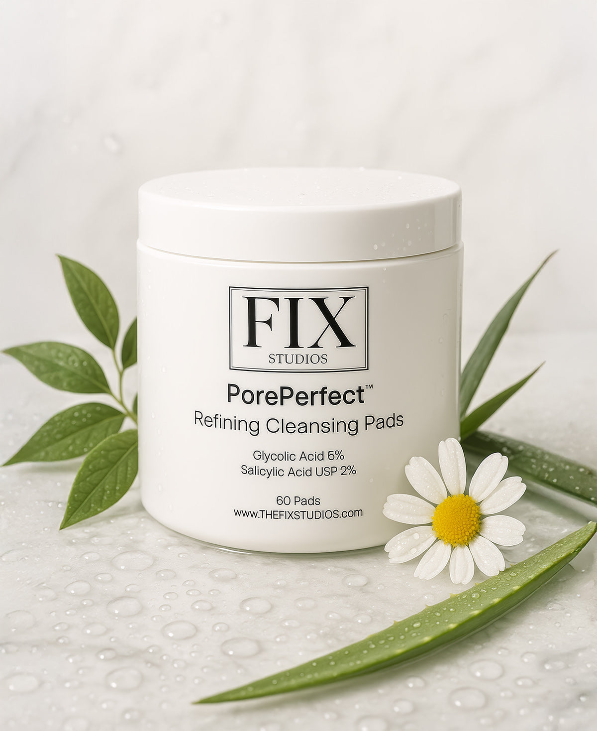 A jar of Fix Studios PorePerfect™ Refining Cleansing Pads Medical-Grade Acne Product surrounded by water droplets and botanicals on a white marble background