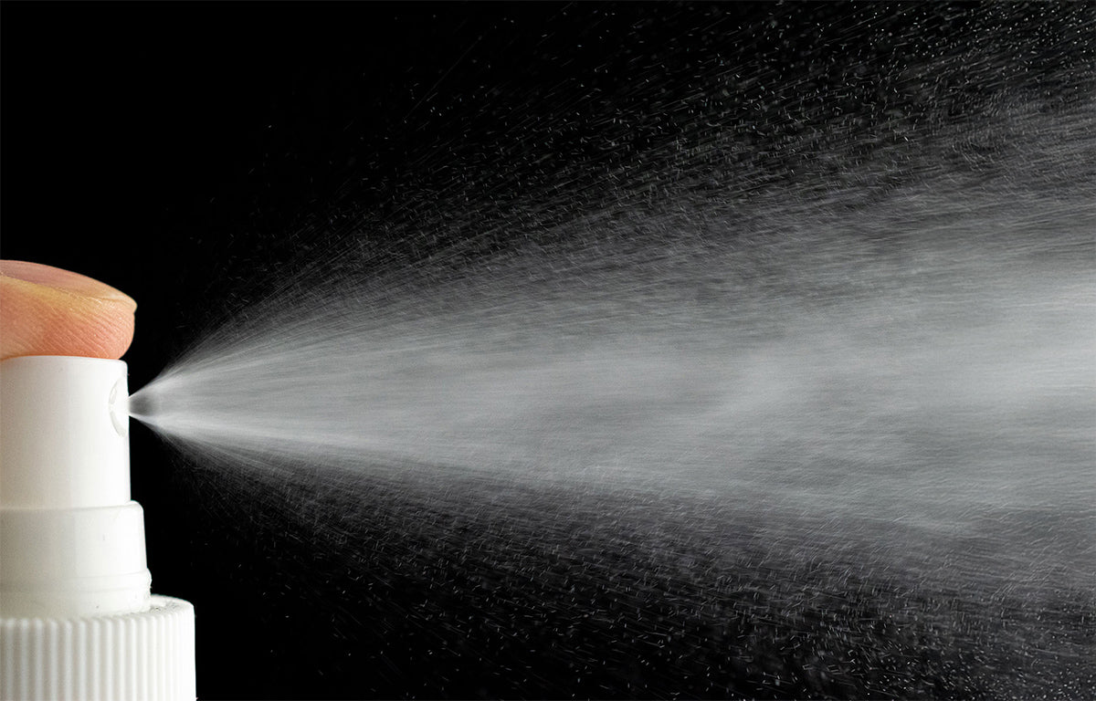 Fix Studios ZenMist™ BioCalm Antioxidant Spray pictured spraying a fine mist