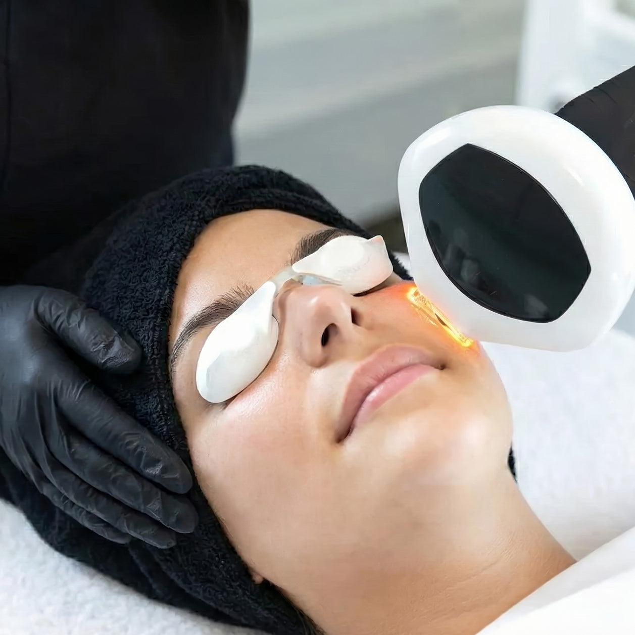 A woman receives a treatment of Lumecca IPL photo facial Cincinnati Mason OH at Fix Studios